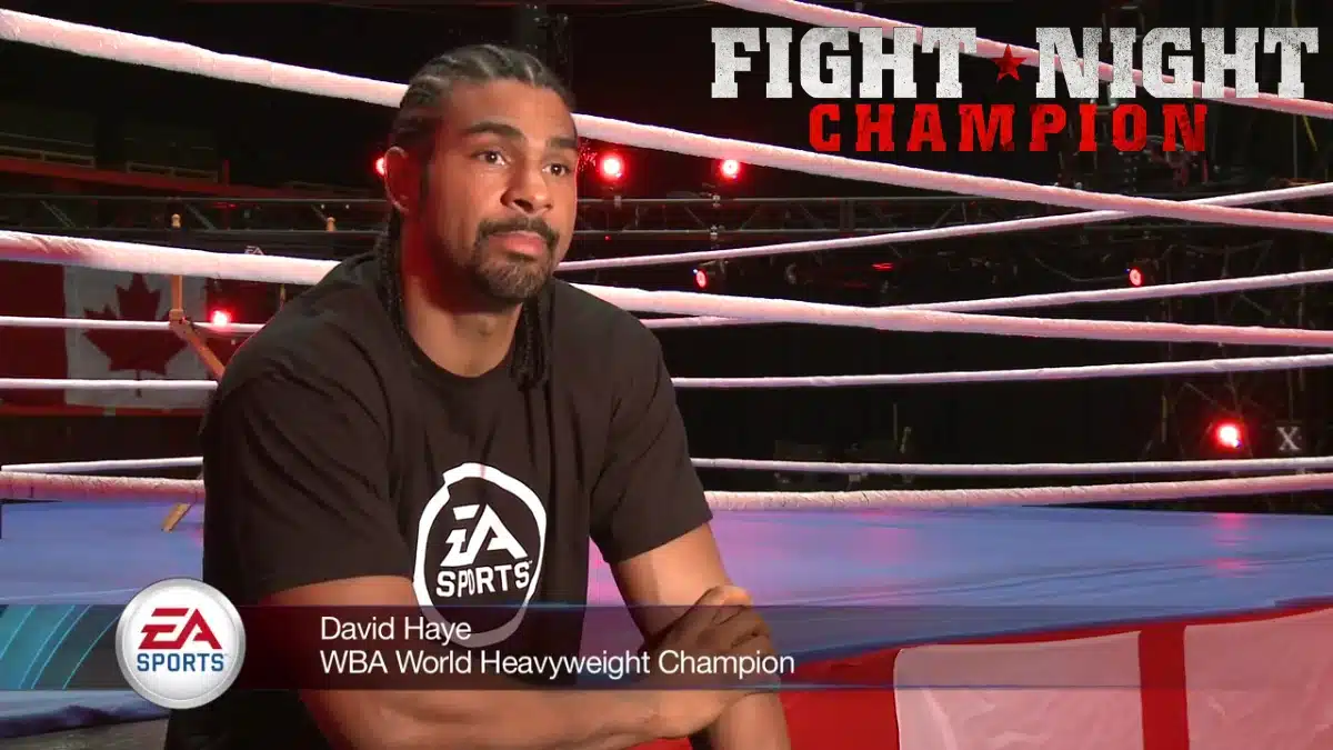 David Haye discusses Fight Night Champion while seated inside a boxing ring during EA Sports promotional filming.