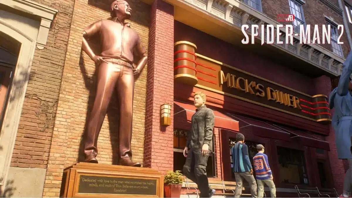 Bronze statue of Stan Lee standing with his hands on his hips outside Mick's Diner