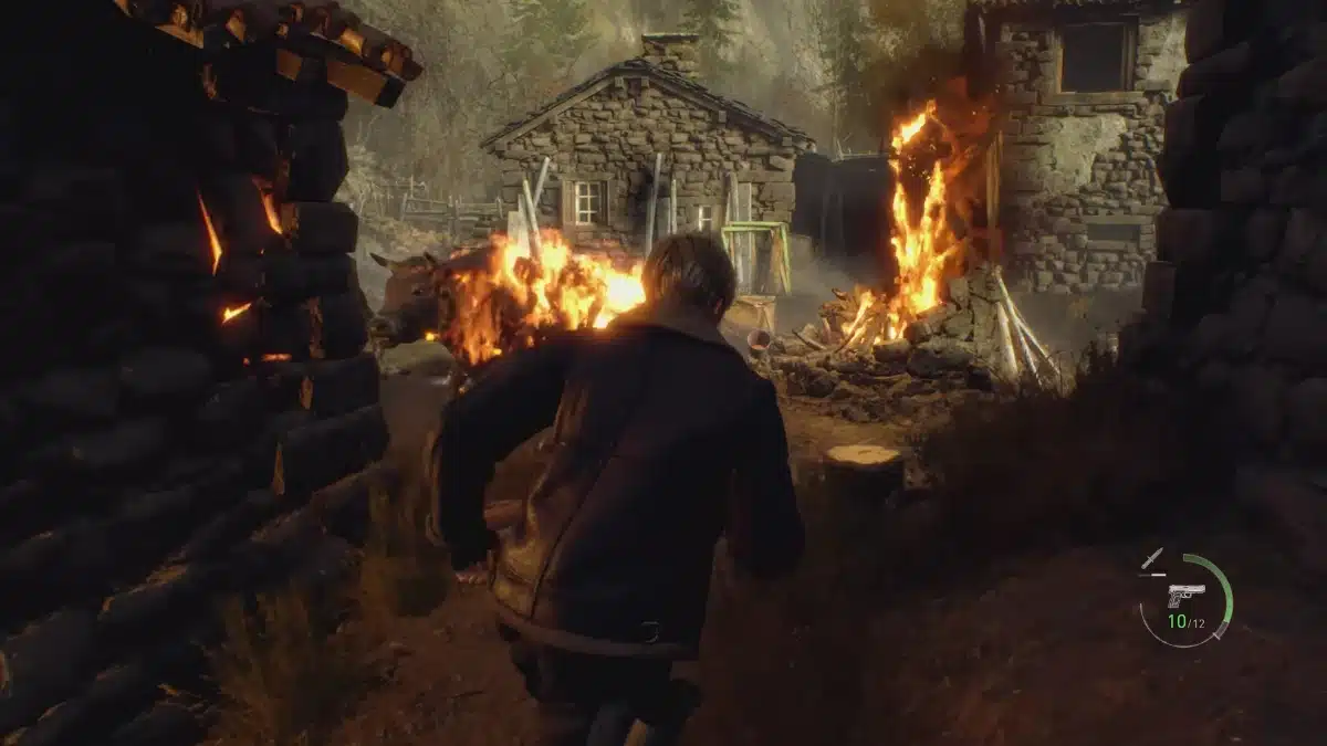 A cow on fire in the Village area in Resident Evil 4 Remake.
