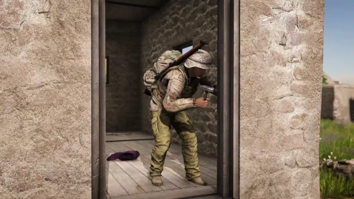 A player rebuilding a door in DayZ Badlands
