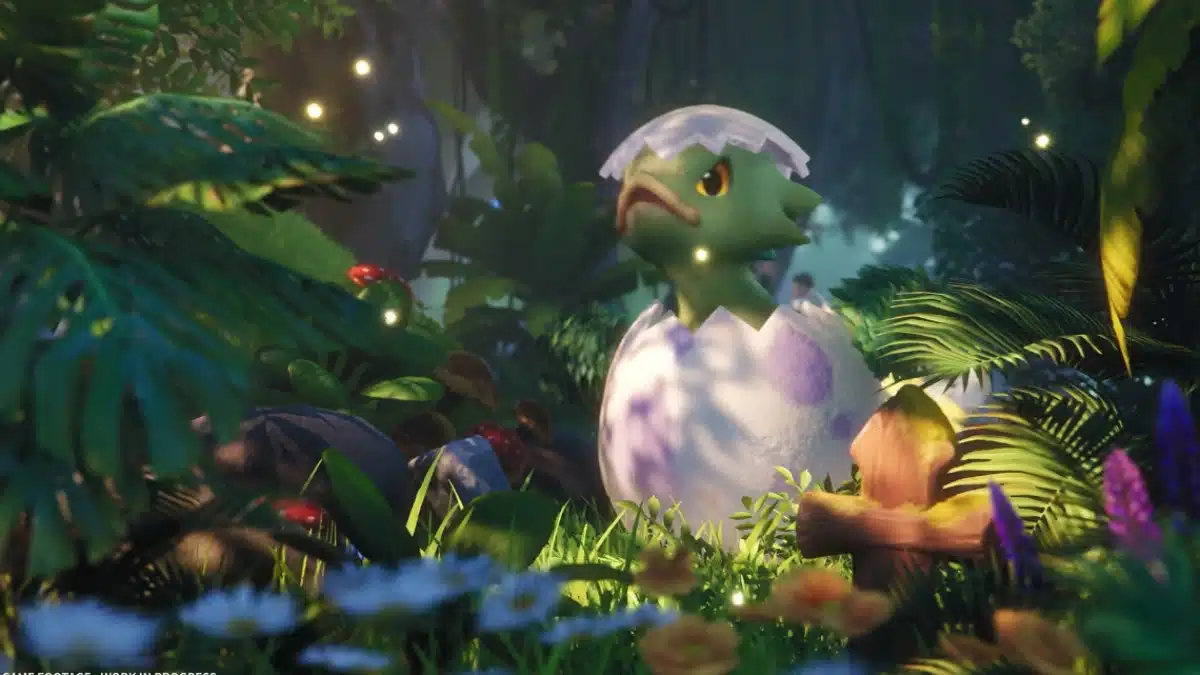 A small, green, cartoonish creature with large yellow eyes and a cracked eggshell on its head hatches from a large, speckled egg in a lush jungle environment.