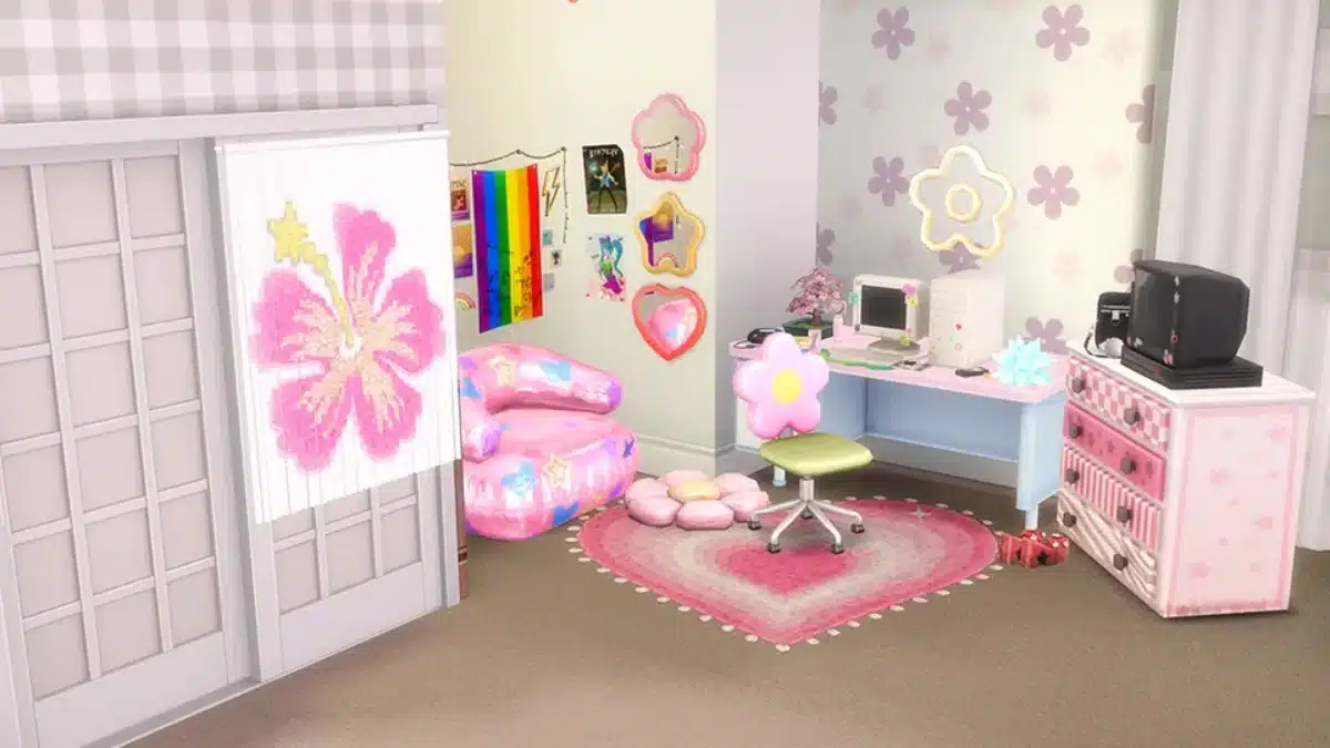 A brightly colored, whimsical bedroom with a pink and purple floral theme, featuring a pink beanbag chair with star and heart patterns, a desk with a computer, a flower-shaped chair, and a pink heart-shaped rug.