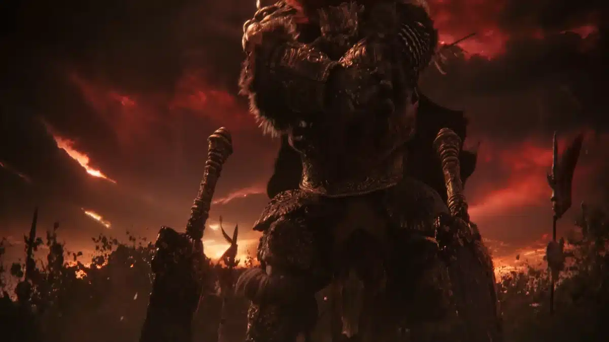 A formidable warrior clad in ornate, dark armor stands ready for battle under a dramatic, fiery red sky.