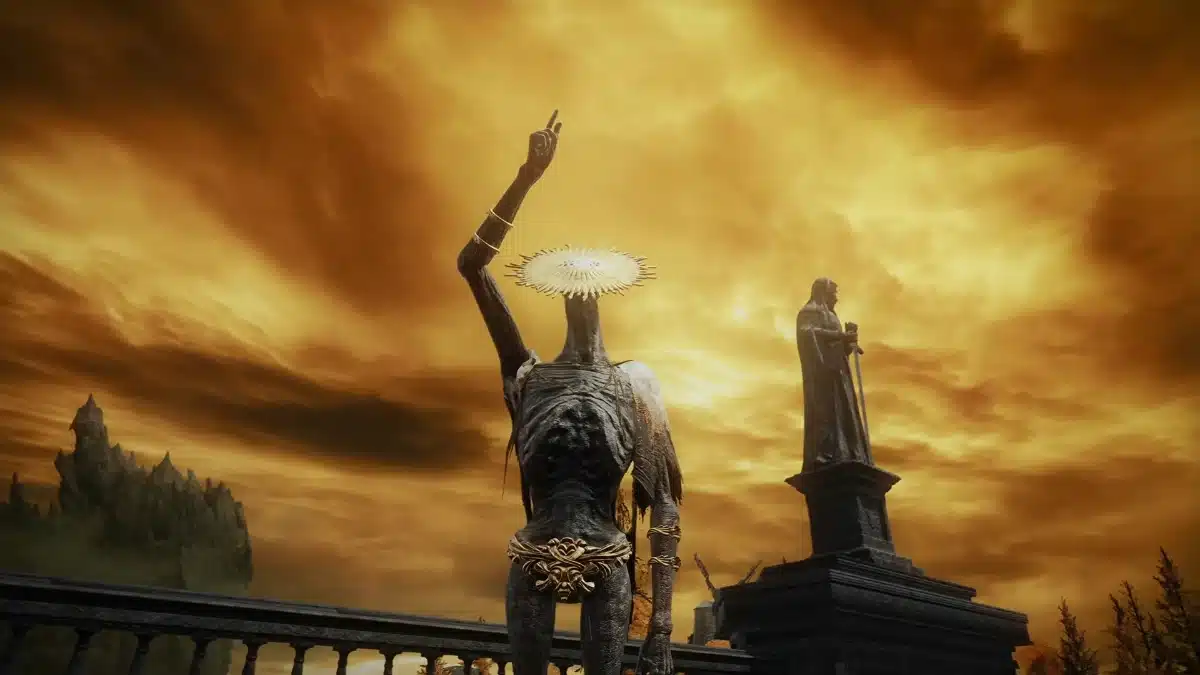 A tall, emaciated figure with a halo of light on its head raises an arm against a dramatic, fiery orange sky. To the right, a dark statue of a robed figure holding a sword stands on a pedestal. In the background, a jagged, rocky land formation juts out from the clouds.